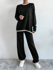 Black knit loungewear set with white trim detail on neckline, cuffs, and hem.