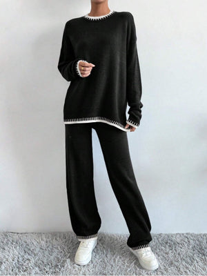 Black knit loungewear set with white trim detail on neckline, cuffs, and hem.