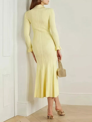 Yellow knit polo collar sweater dress with ribbed texture and ruffled cuffs.