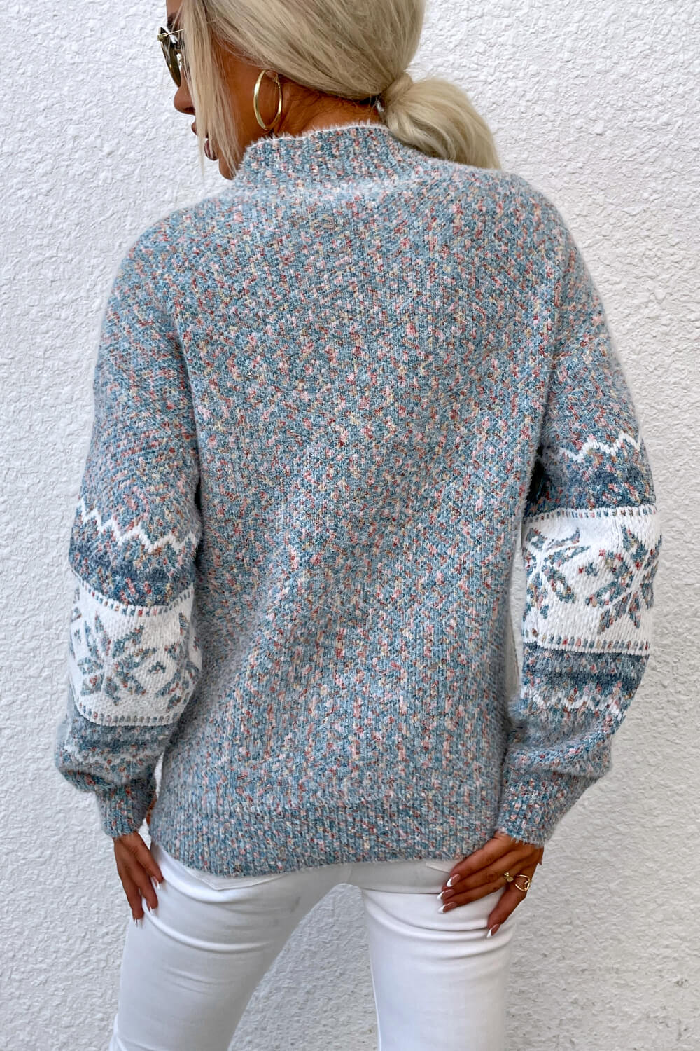 Nordic Fair Isle mock neck knit sweater in Cloudy Blue with snowflake pattern on sleeves.