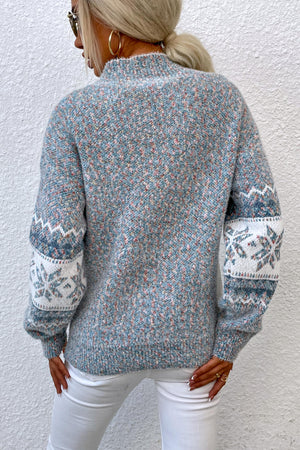 Nordic Fair Isle mock neck knit sweater in Cloudy Blue with snowflake pattern on sleeves.