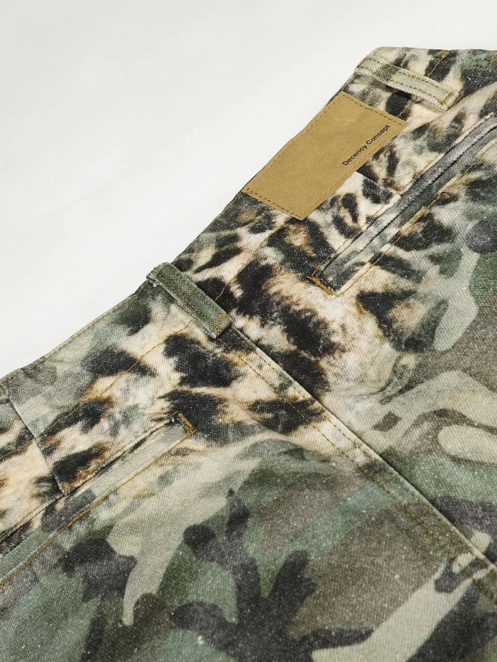Maternity cargo capris with leopard and camouflage print, featuring a tan leather brand patch.