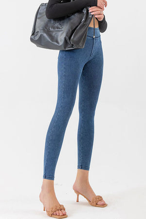 Medium wash denim-effect leggings with a high waist and skinny fit.