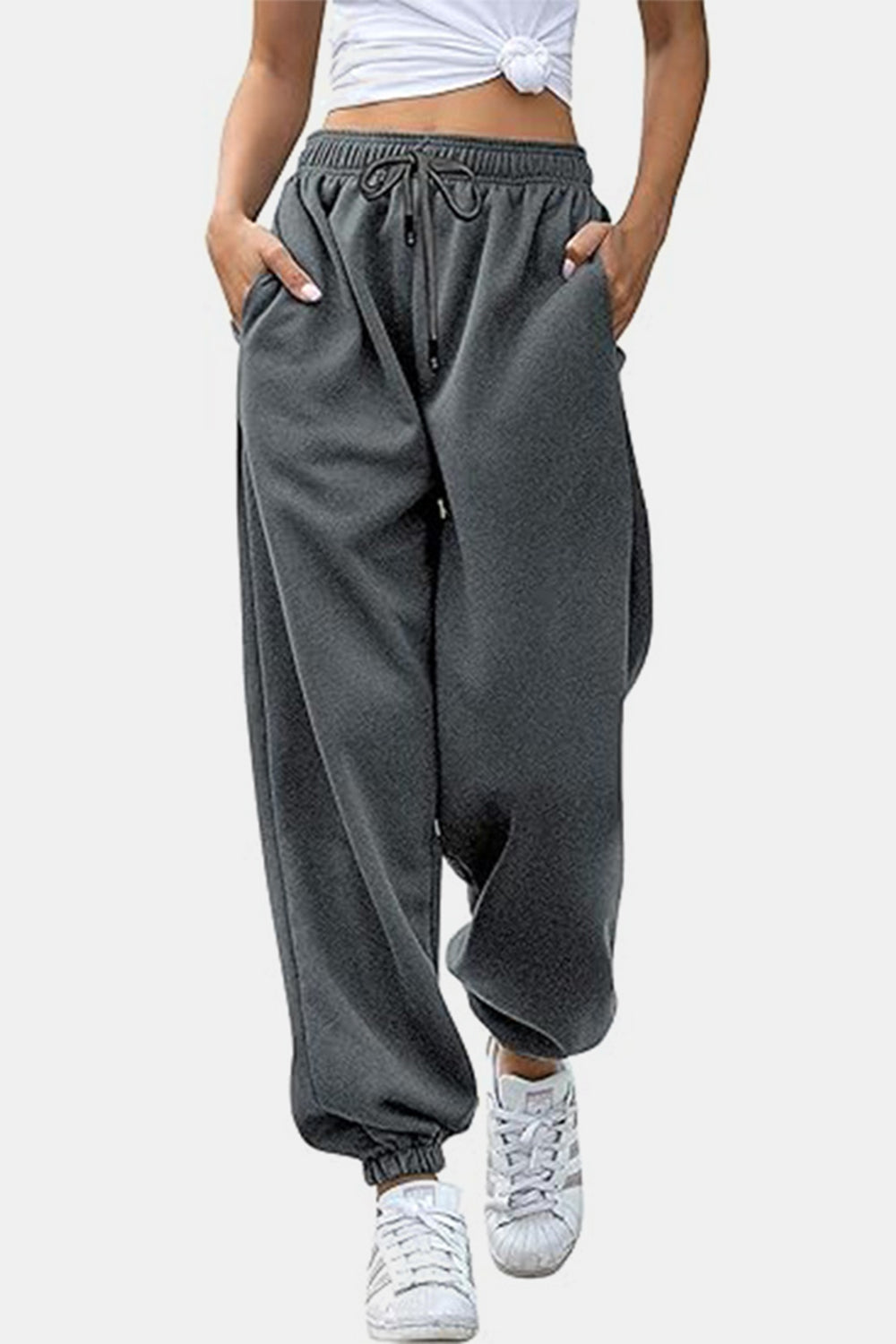 Relaxed-fit gray sweatpants with drawstring waist and cuffed ankles.