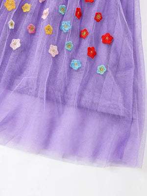 Purple tulle baby dress with colorful floral embroidery.