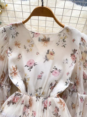 Apricot floral chiffon blouse with balloon sleeves and ruched waist detail.