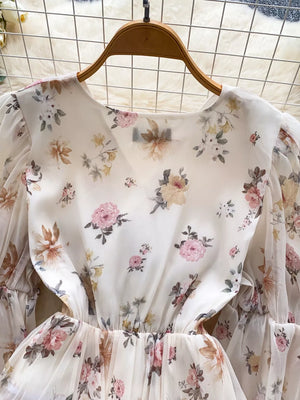 Apricot floral chiffon blouse with balloon sleeves and ruched waist detail.