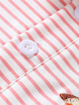 Pink striped cotton polo shirt for baby with embroidered duck detail and white buttons.