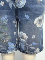 Blue denim shorts with a botanical print and relaxed fit.