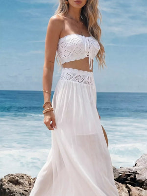 White crochet bandeau top with tie front and matching maxi skirt with cutout detail.