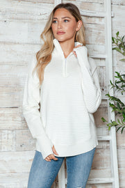 White ribbed knit funnel neck pullover sweater with quarter zip and thumbholes.
