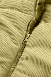Corduroy padded vest in sage with a zipper detail.