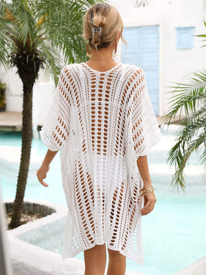White open-knit caftan cover-up with short sleeves and side slits.