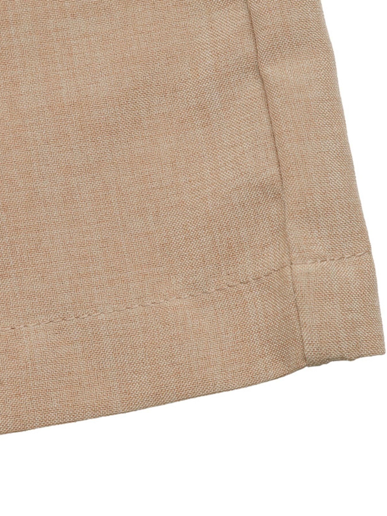 Geometric pattern halter jumpsuit in beige linen-look fabric with visible stitching detail.