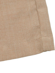 Geometric pattern halter jumpsuit in beige linen-look fabric with visible stitching detail.