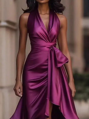 Purple satin high-low ruffled maxi dress with halter neck and cinched waist tie.