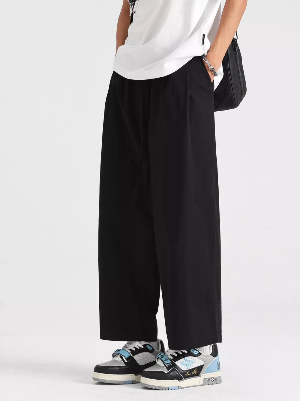 Men's black lightweight drawstring sweatpants with a relaxed fit.