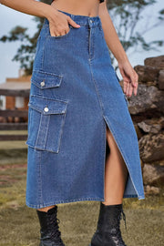 Denim midi skirt with cargo pockets and front slit in medium wash.