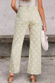 Polka dot high-waisted wide-leg jeans in light yellow denim with white polka dots.