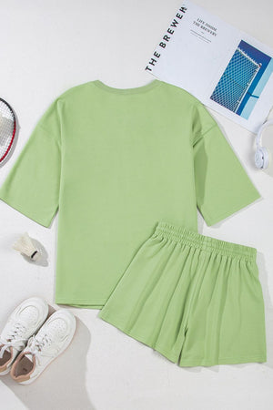 Lime cotton loungewear set with relaxed fit t-shirt and elastic waist shorts.