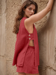 Scarlet linen co-ord set with cut-out back and button detail.