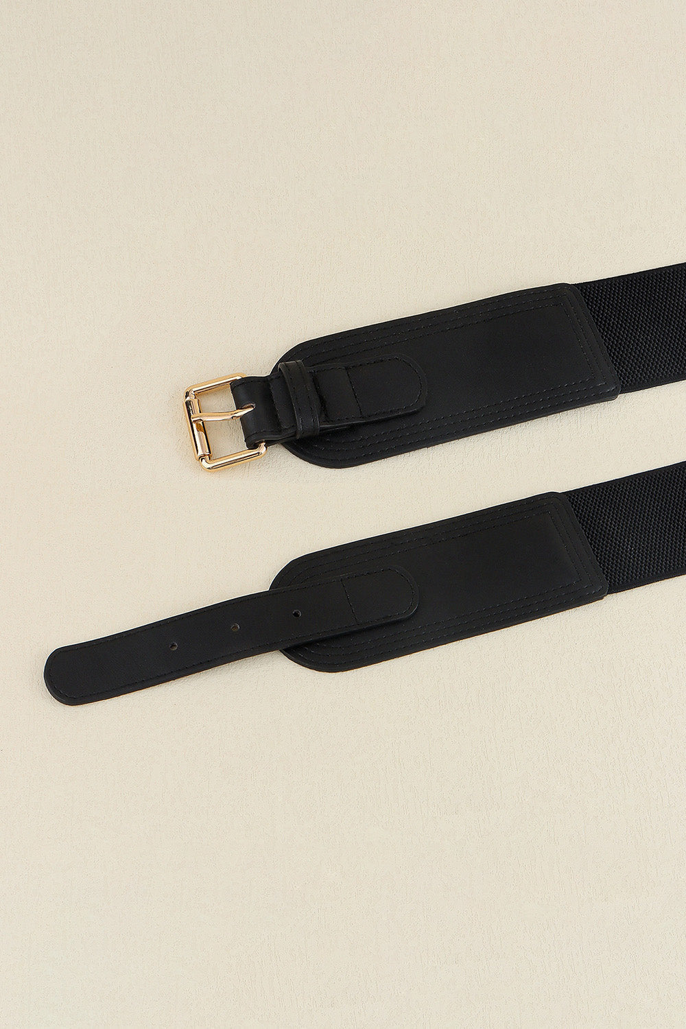 Black elasticated waist belt with gold buckle and faux leather details
