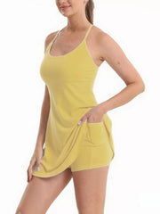 Yellow scoop neck cami activewear set with pocketed shorts.