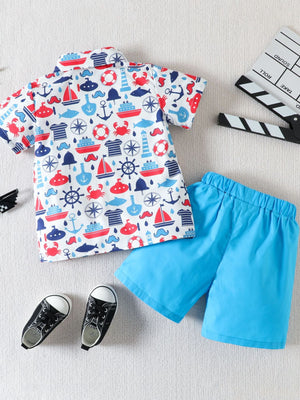 Toddler boys' cotton button-down shirt and shorts set with nautical print and blue shorts.