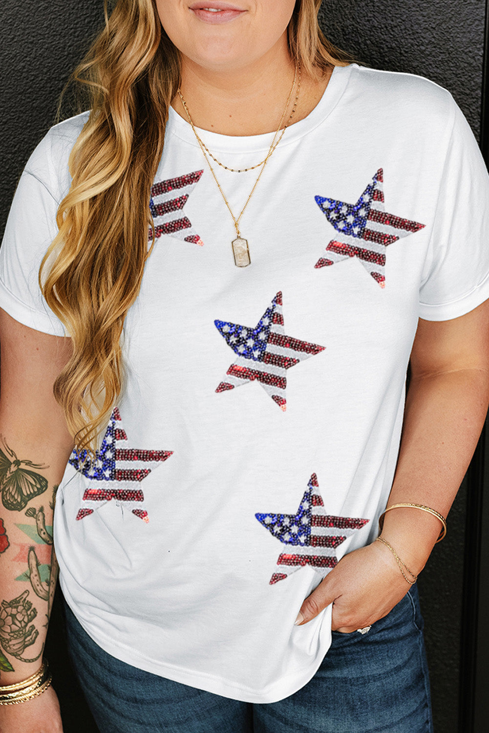 White embellished star tee with American flag detail, casual crew neck.