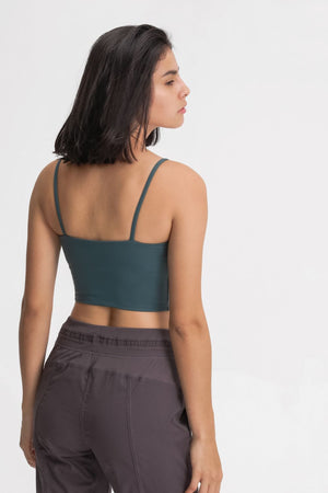 Teal scoop neck crop tank top with thin straps, shown from the back.