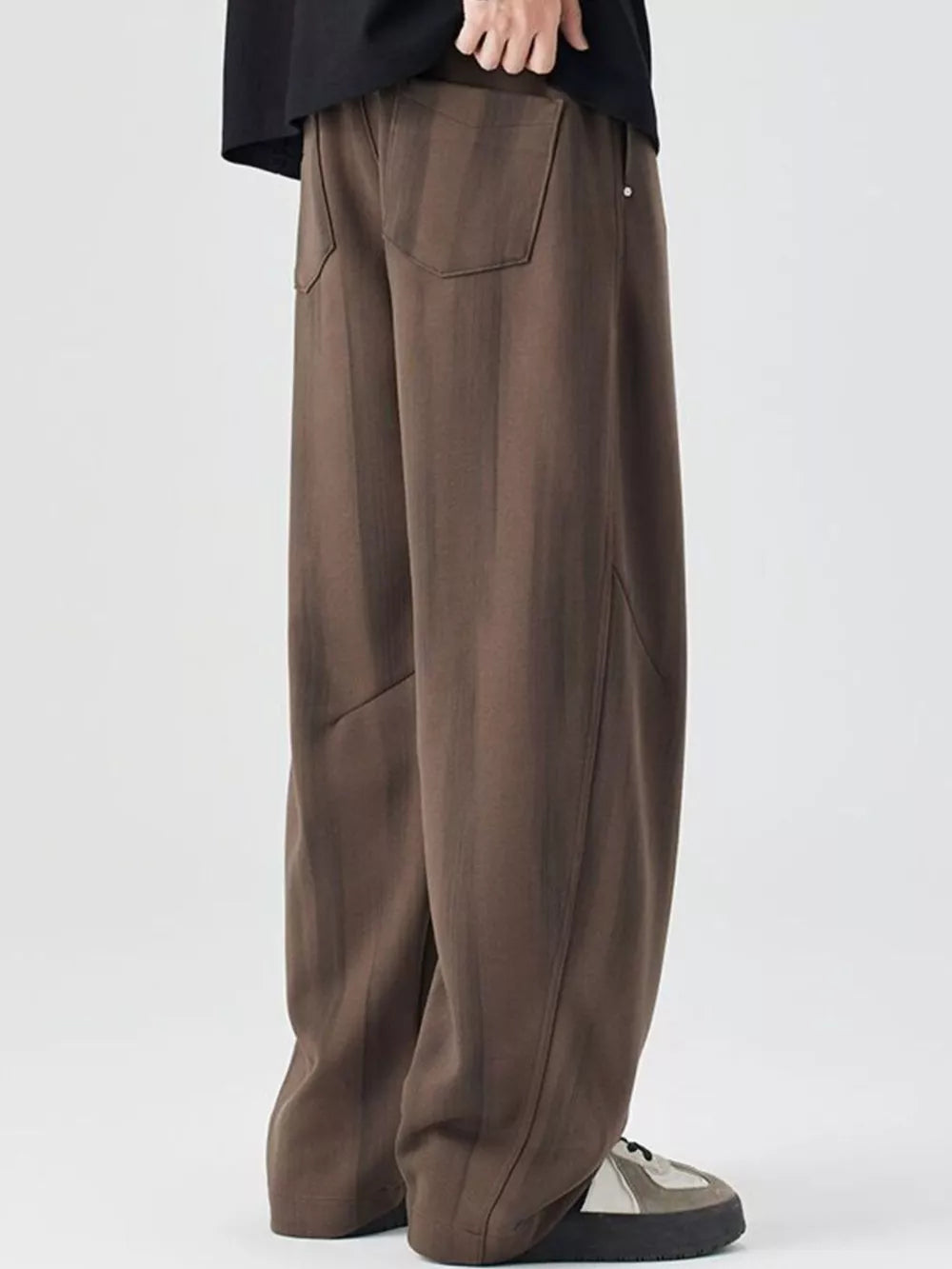 Brown striped jogger pants with back pockets and drawstring detail.