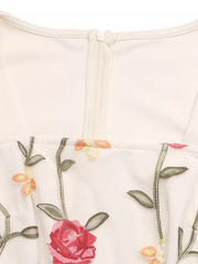 Beige floral embroidered ruffle jumpsuit with zipper detail
