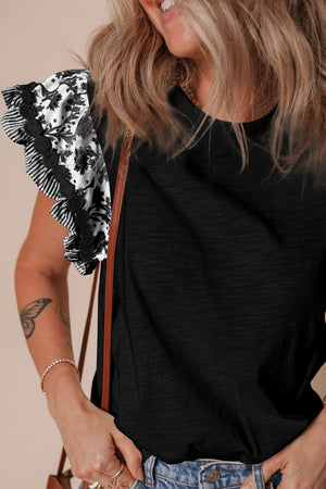 Black t-shirt with embroidered floral flutter sleeves and striped trim.