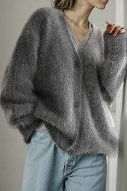 Fluffy angora V-neck cardigan in dark gray with button front and relaxed fit.