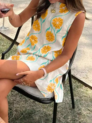 Delicate floral mini dress in Gum Leaf with high neckline.