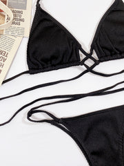 Black ribbed halter bikini with crisscross detail and tie straps.