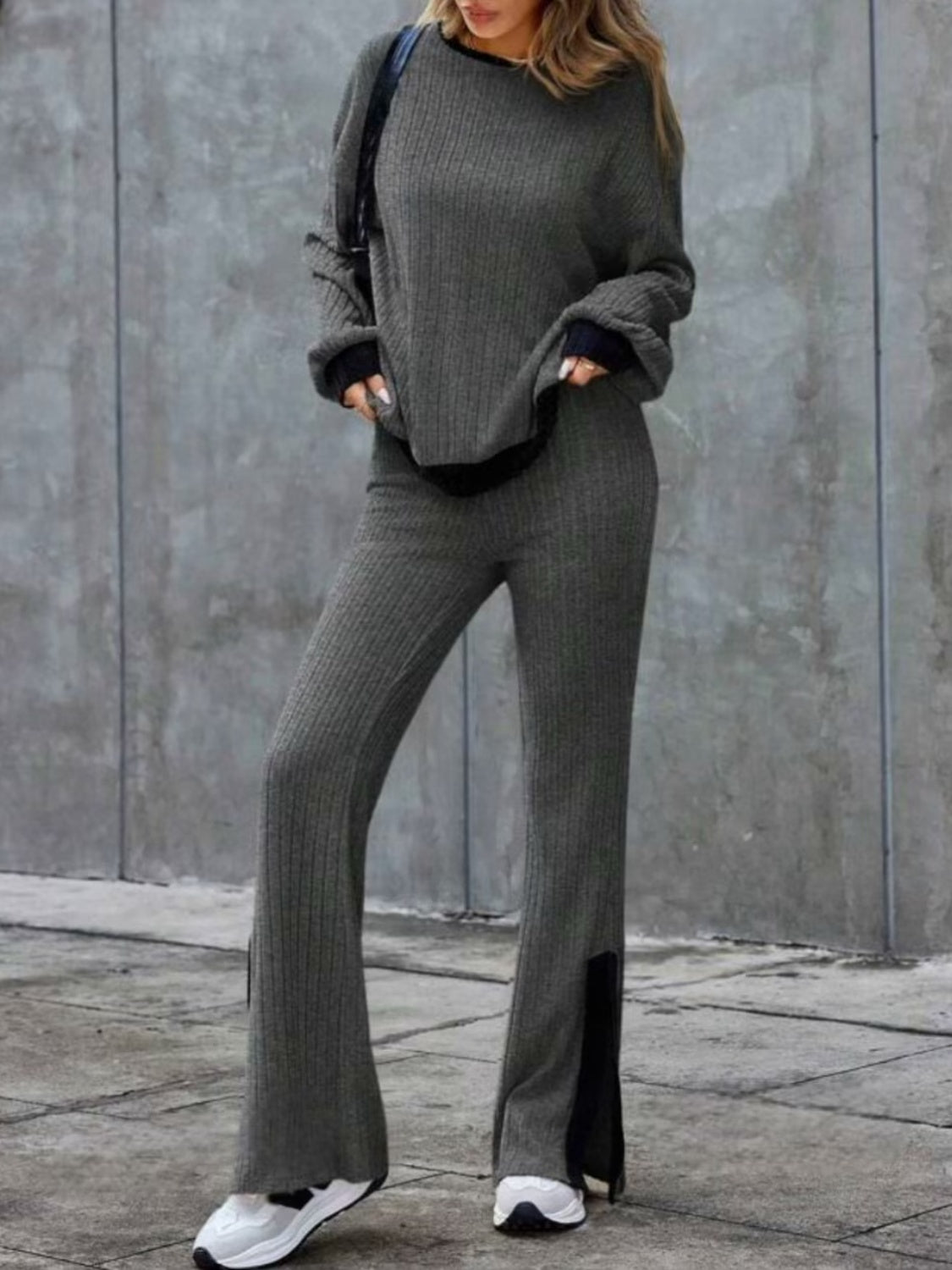 Gray ribbed knit lounge set with slit hem pants and crewneck sweater.