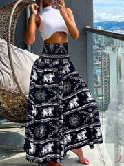 Bohemian print smocked waist pants in dark navy with an elephant pattern.