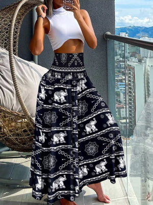Bohemian print smocked waist pants in dark navy with an elephant pattern.