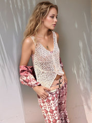 Open-knit crochet tank top in beige with a V-neck and cropped hem.