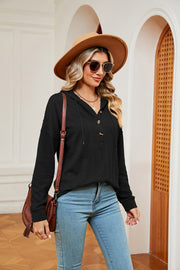 Black textured henley hoodie with drop shoulder and button detail