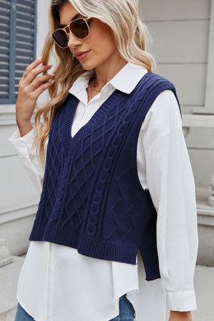 Dark Navy cable knit diamond pattern sweater vest with V-neck, worn over a white collared shirt.