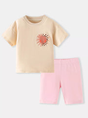 Toddler cotton set with peach sun graphic tee and pink bike shorts.