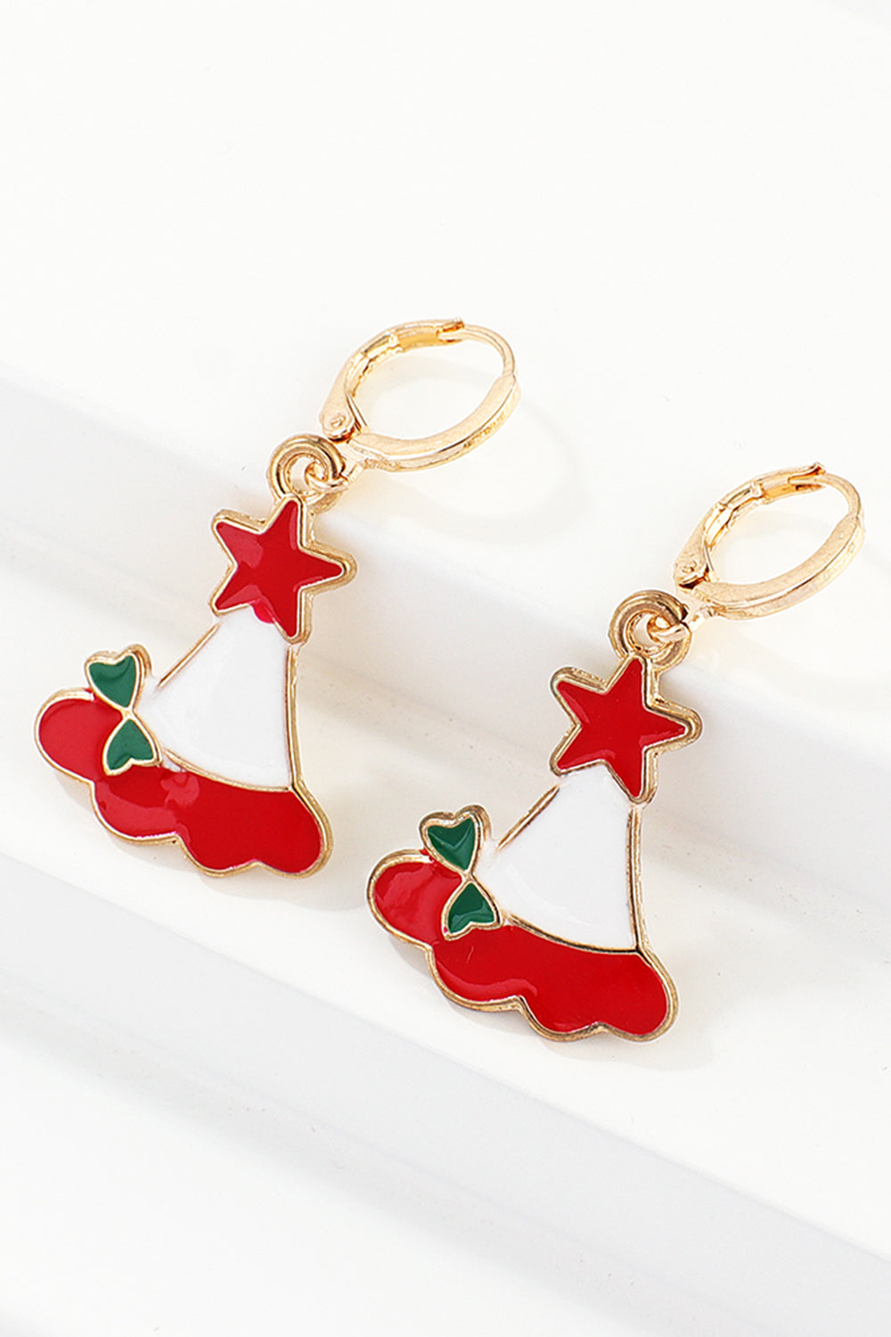 Festive Santa hat charm hoop earrings with red stars and green bows.