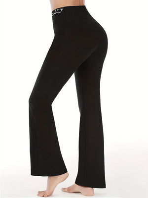 Black bootcut leggings with a white smile detail on the waistband.