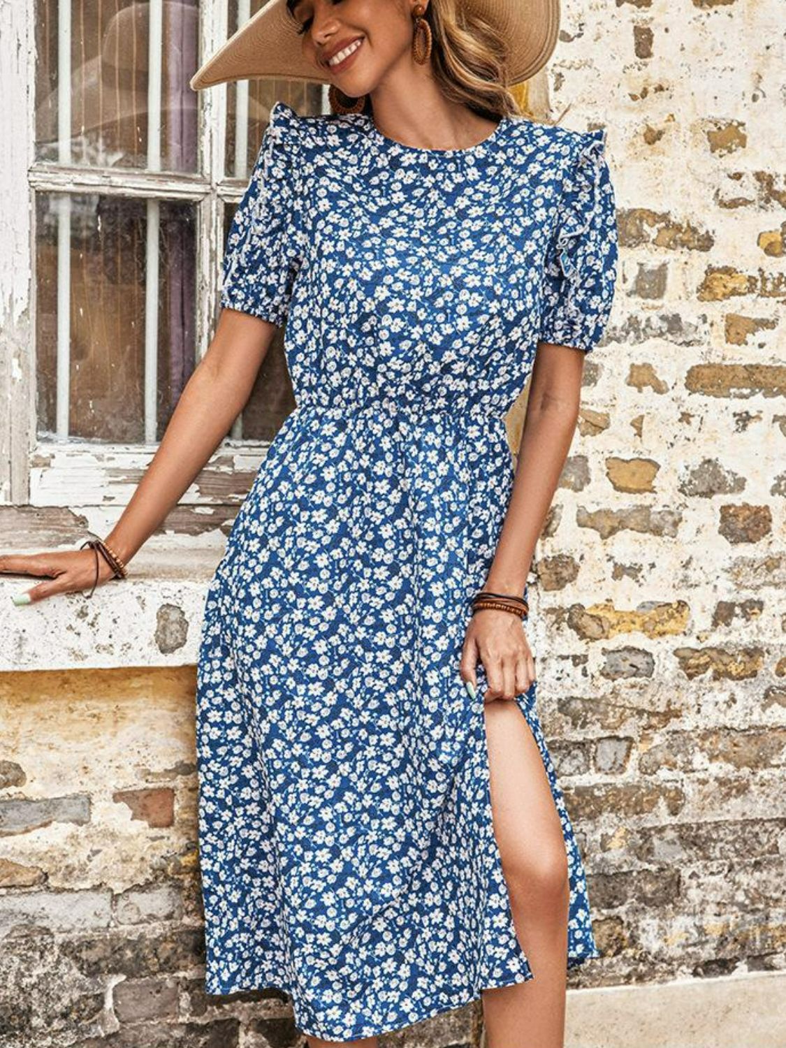 Blue floral puff sleeve midi dress with a high slit and cinched waist.