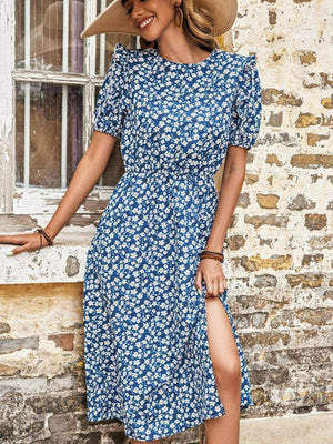 Blue floral puff sleeve midi dress with a high slit and cinched waist.
