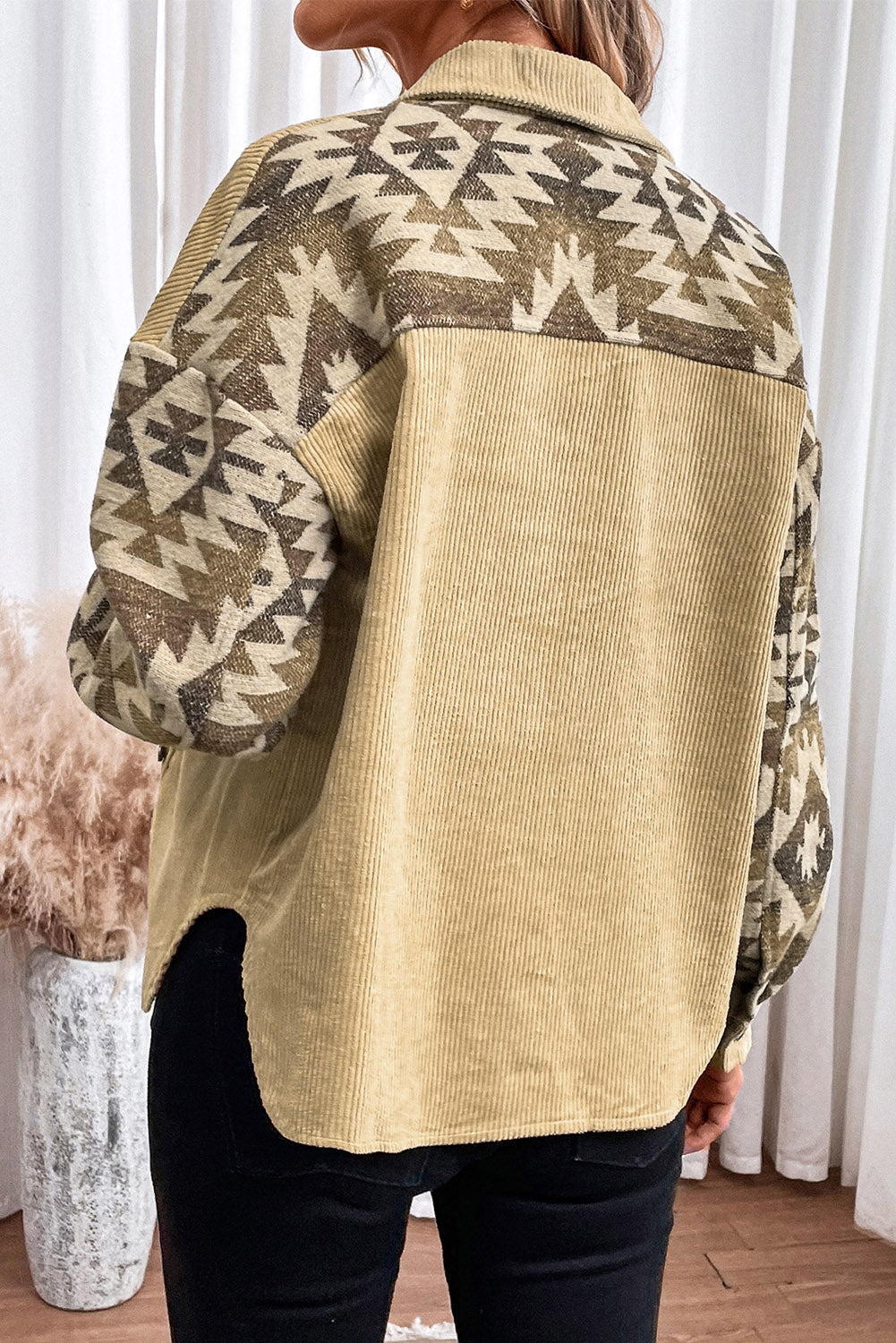 Corduroy jacket in chartreuse with Aztec patterned sleeves and back panel.