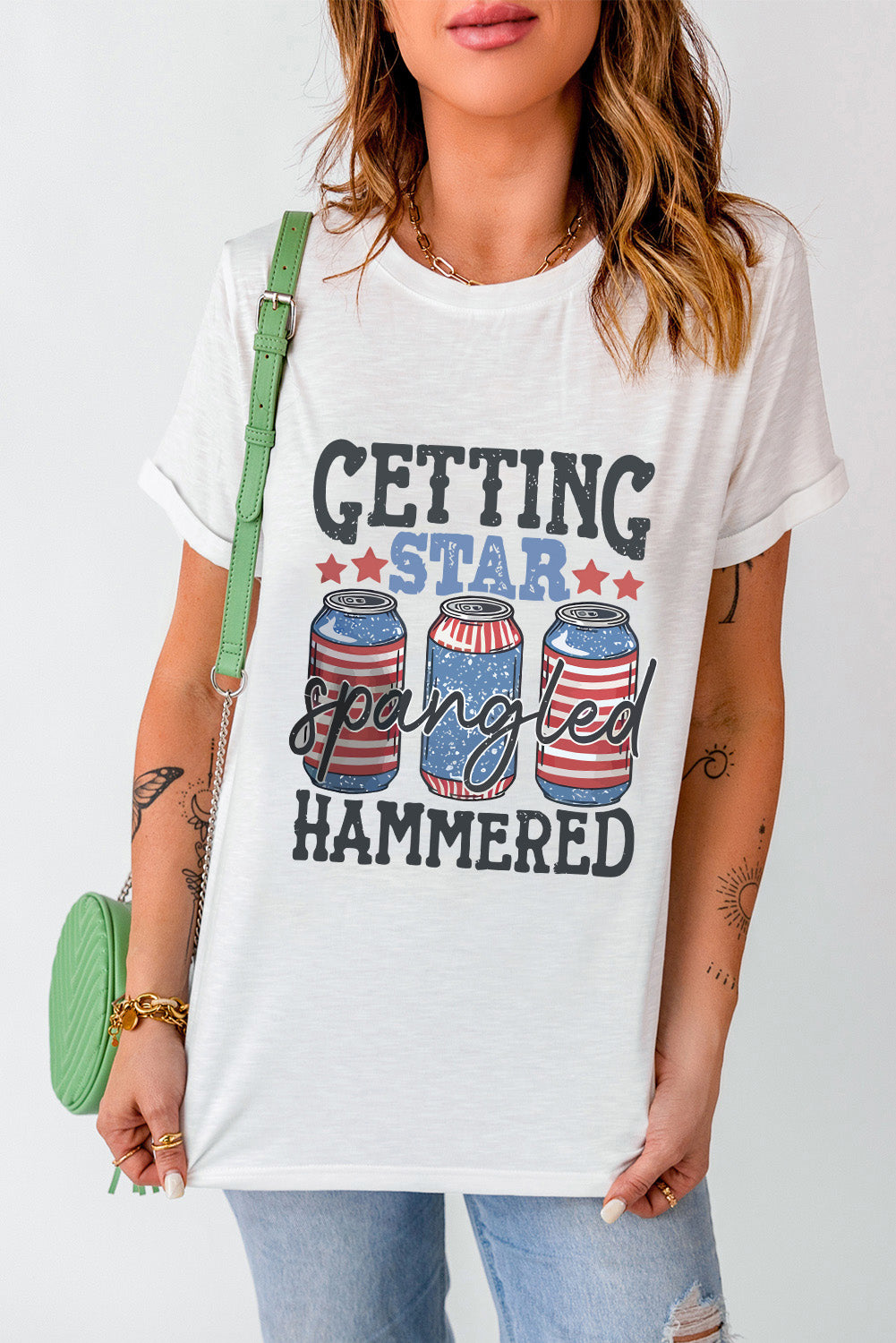 White graphic t-shirt with American flag beer cans and text.