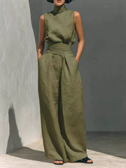 Army green sleeveless turtleneck and wide-leg pants set with belted waist.